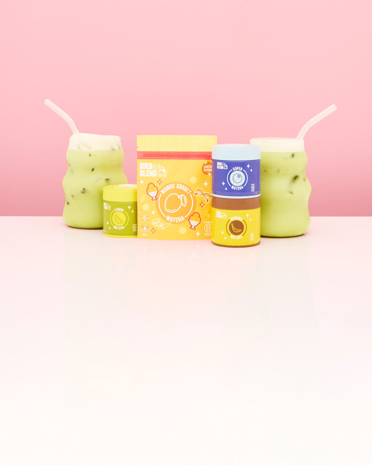 fruity matcha tea powder in tins and pouch & iced matcha latte