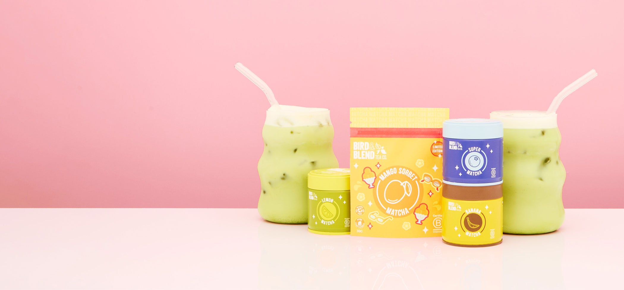 fruity matcha tea powder in tins and pouch & iced matcha latte