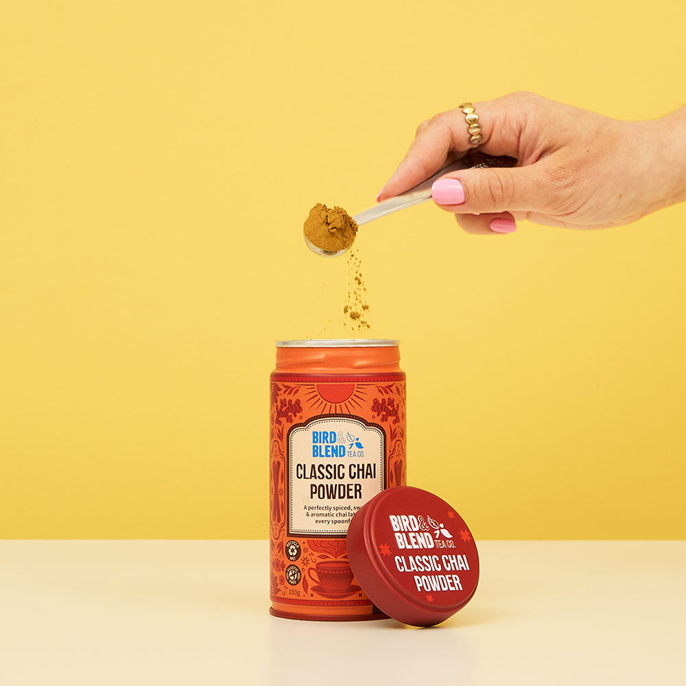 Classic Chai Tea Powder Tin & Spoon Sprinkling the Chai Powder