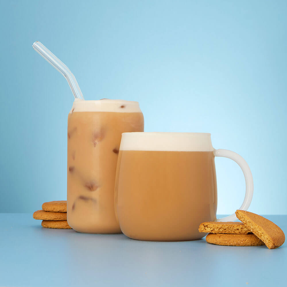 gingernut biscuit hot and iced tea latte in mug and gingernut biscuits
