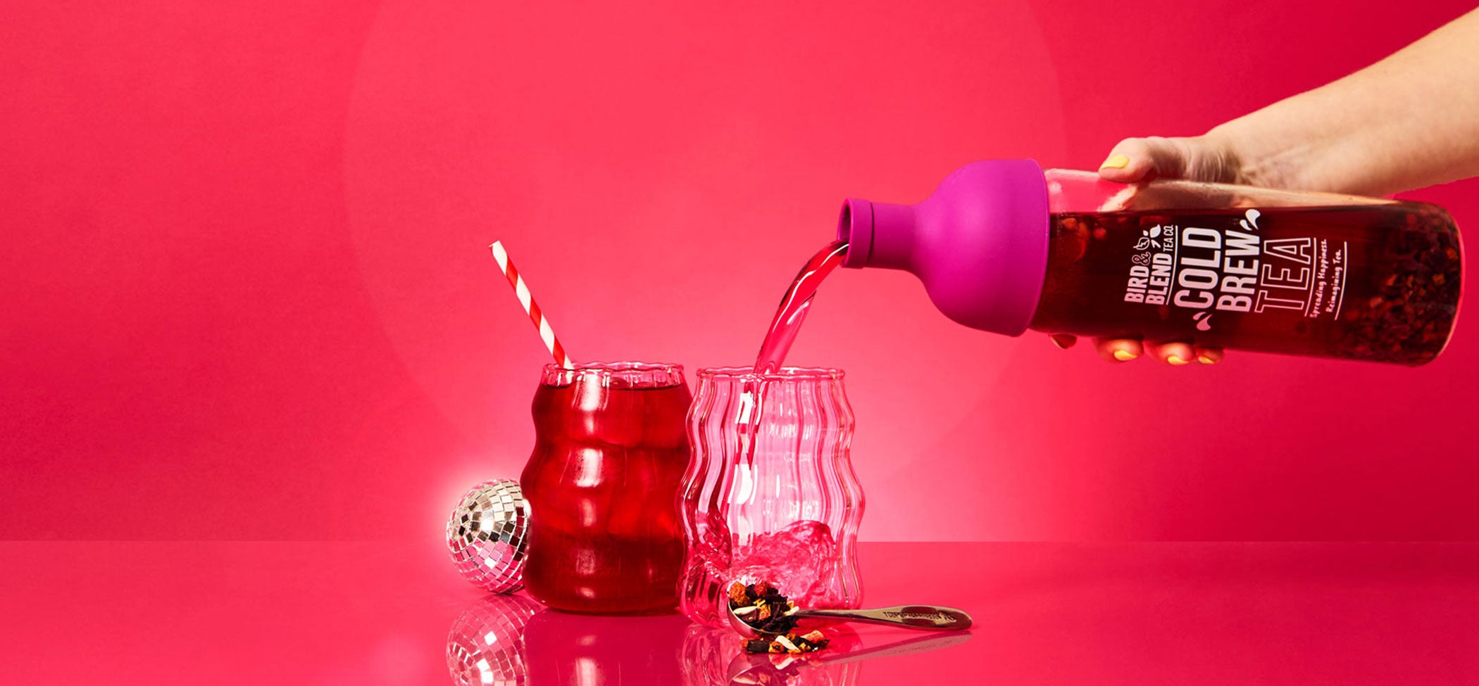 plum purple cold brew tea bottle pouring bubblegum pop tea iced with a straw