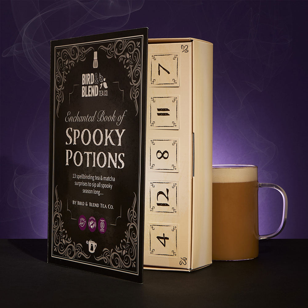 spooky calendar book slightly open with hot tea