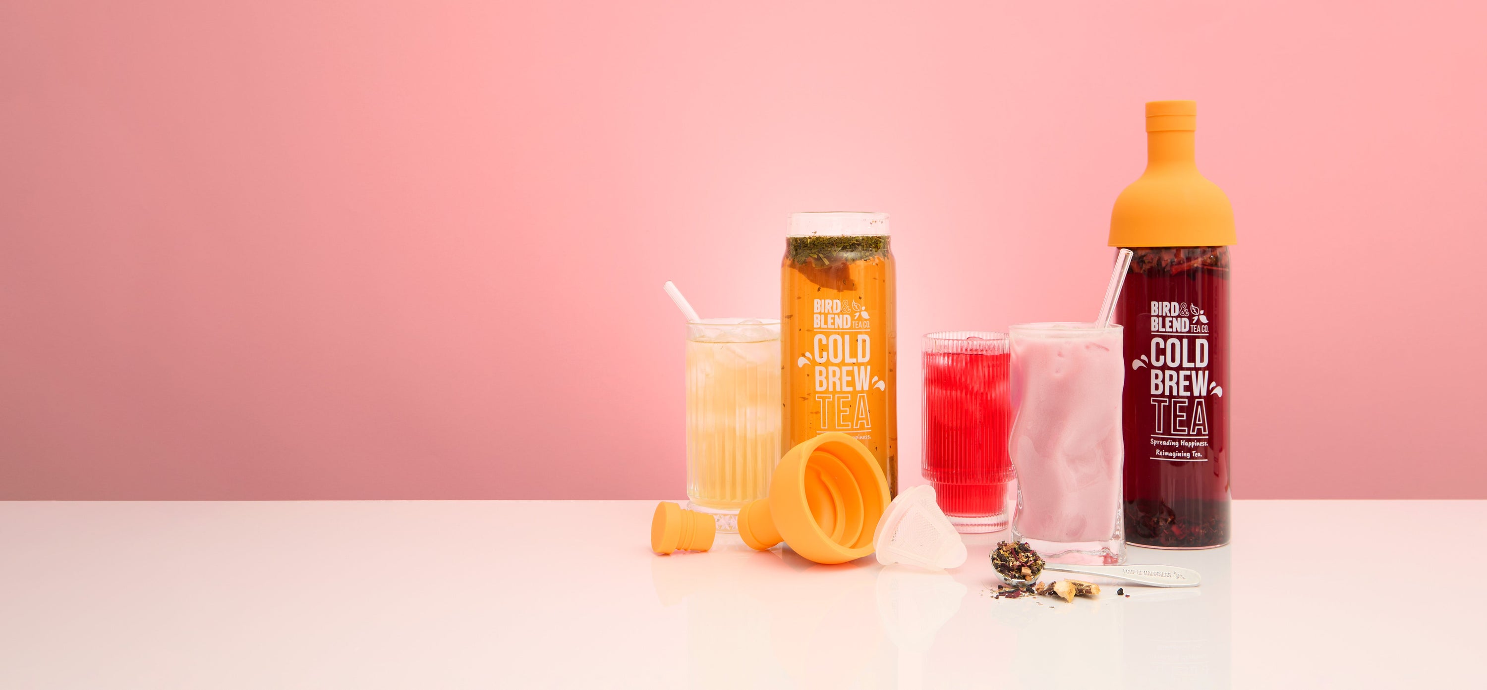 Cold brew tea bottles filled with tea and tea brewed in lemonade water and milk