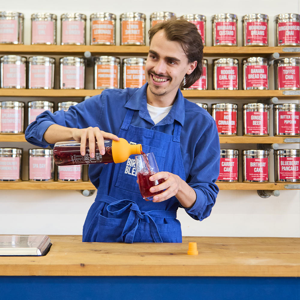 Store manager ben by the tea wall