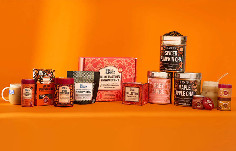  chai collection full of autumn matcha & loose leaf pumpkin spiced chai collection & hot & iced chai lattes & tea powder & matcha in tins stacked on top of each other & chai gift cube & deluxe matcha & tea powder gift set blog template 
