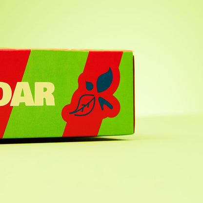close up on caffeine free advent calendar red &amp; green stripe &amp; bird &amp; blend tea co. logo