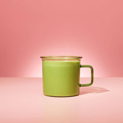 matcha latte in green matcha glass mug