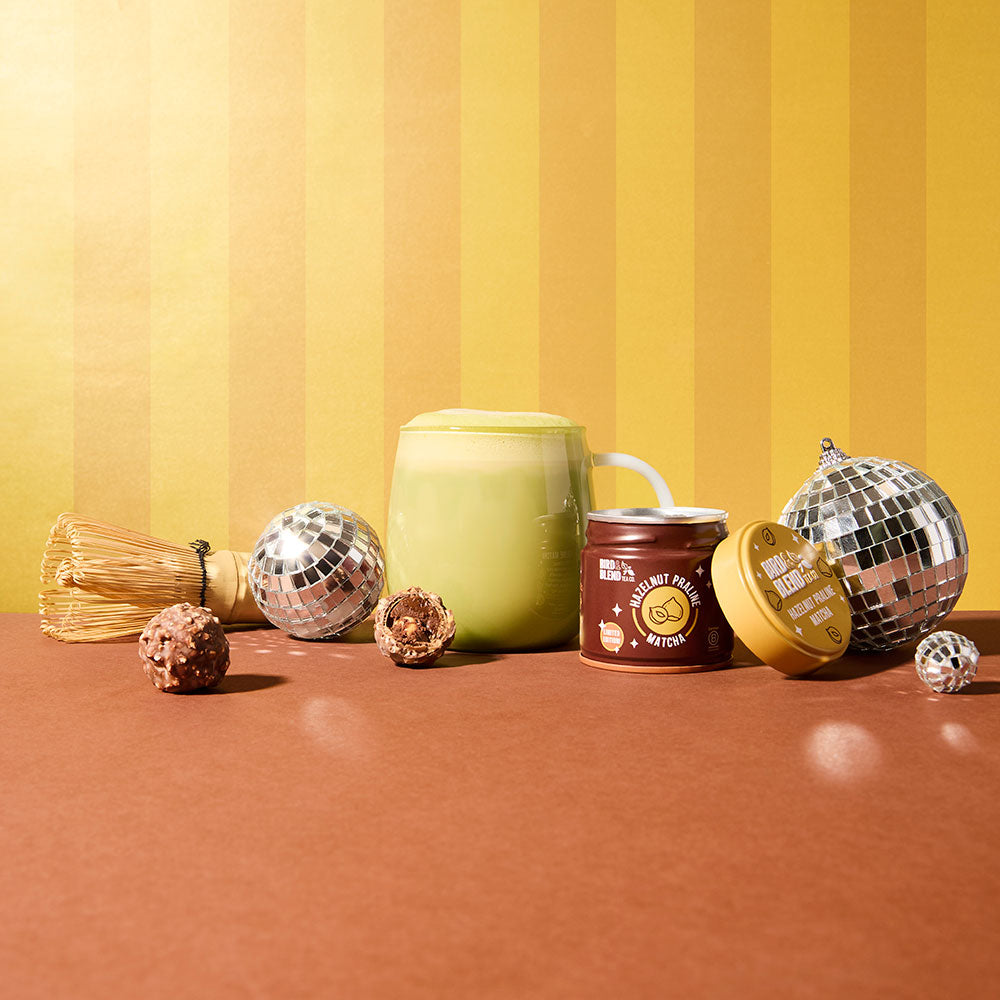 hazelnut praline matcha tin and hot matcha latte