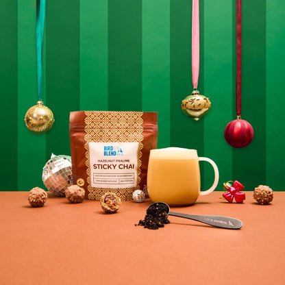 Hazelnut Praline sticky chai and hot tea latte and spoon filled with sticky chai