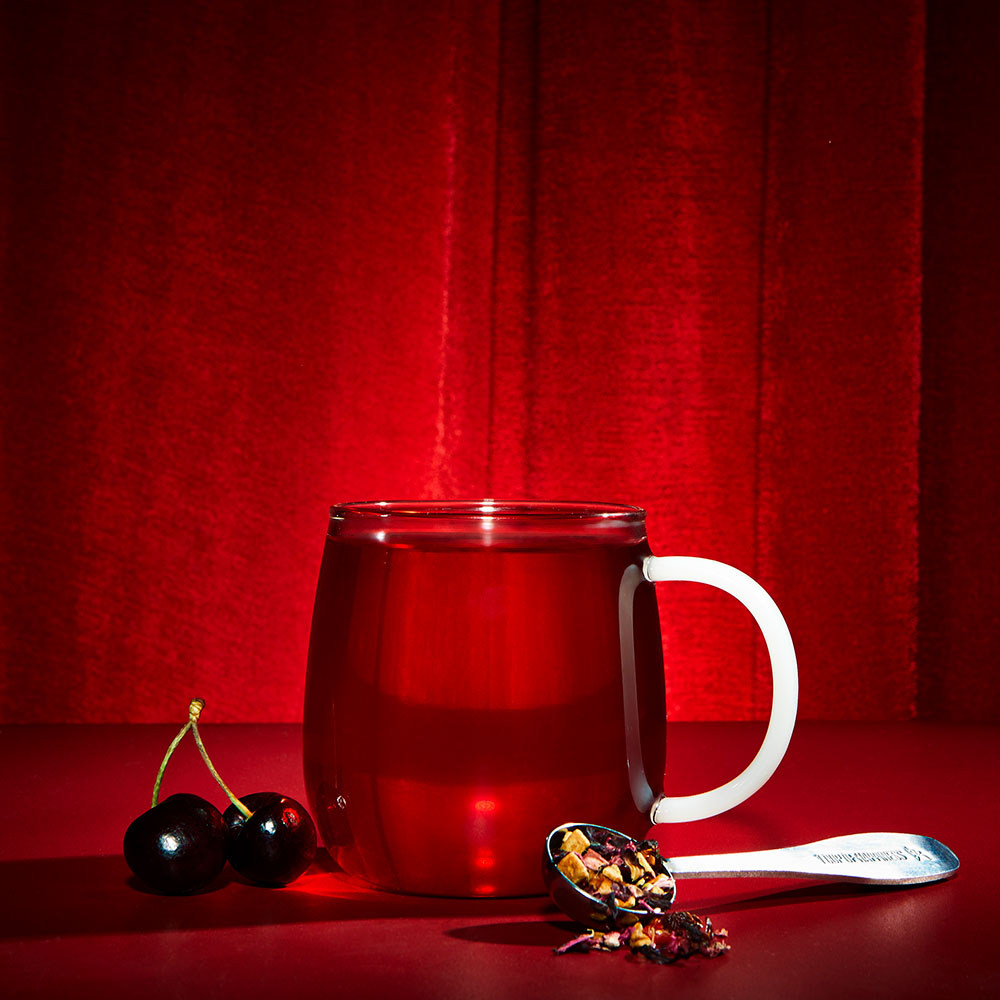  hot cherry tea cherrified! and cherrys and perfect tea spoon filled with loose leaf tea 