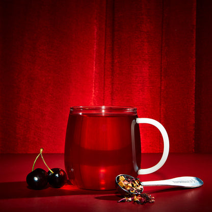 hot cherry tea cherrified! and cherrys and perfect tea spoon filled with loose leaf tea