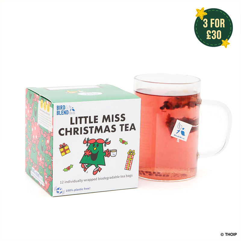 little miss christmas cube with hot tea