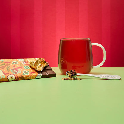 mulled cider chocolate bar and hot tea and spoon filled with loose leaf tea