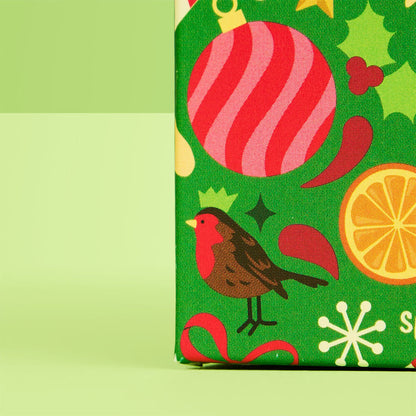 side of cube close up on graphic robin bird &amp; Christmas decorations