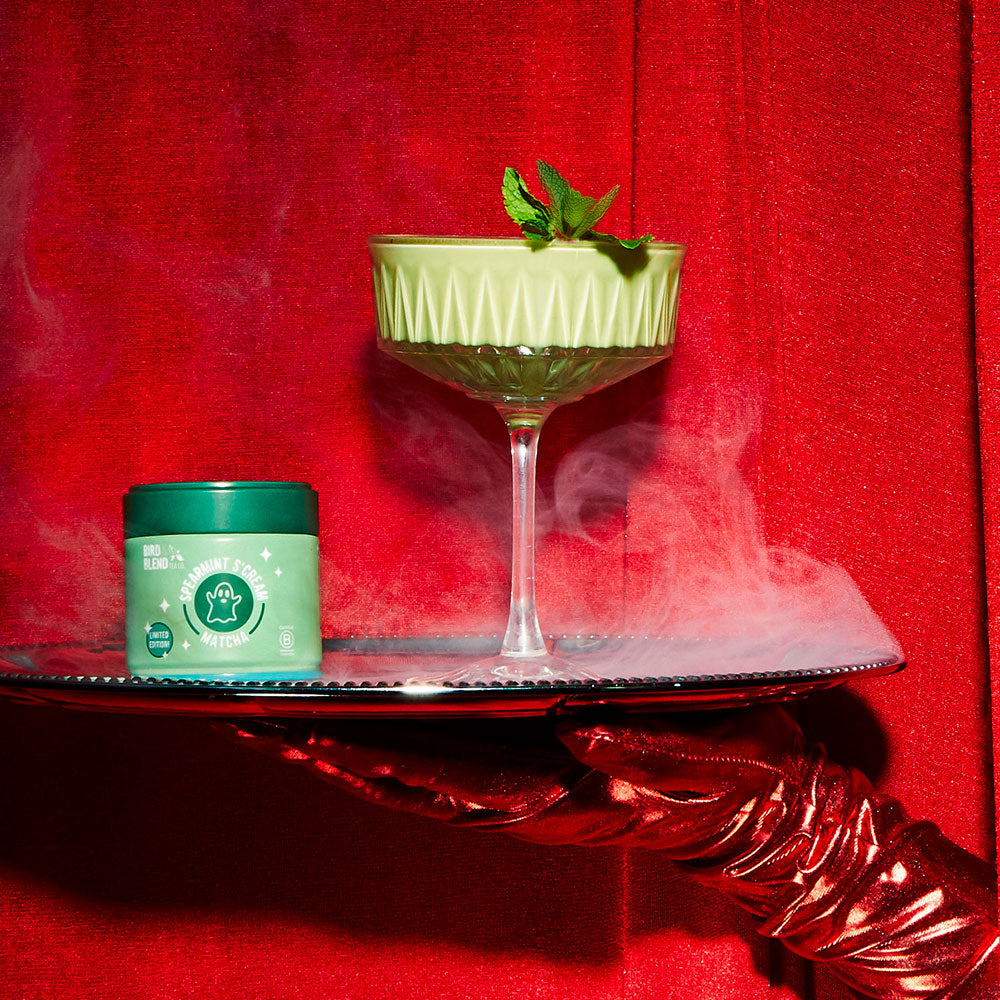 spearmint s'cream matcha tin on a silver platter with spearmint s'cream cocktail