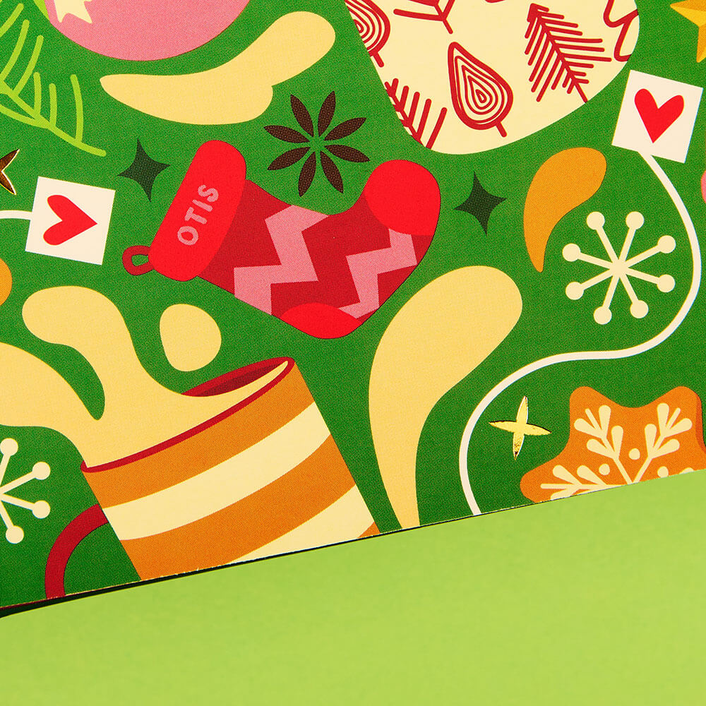 tea advent calendar close up on tea mugs spilling tea graphics and close up on red stocking with the name otis on it
